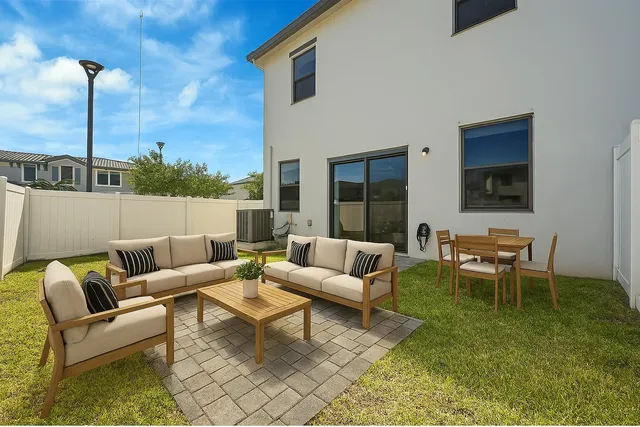 a living room with furniture wooden floor and a table