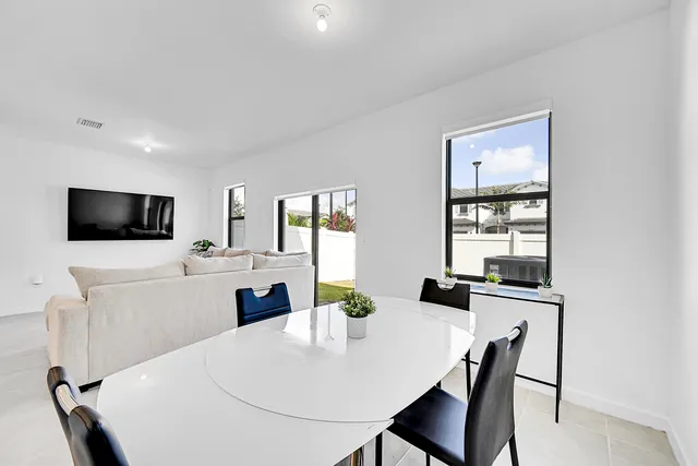 a kitchen with a table and chairs