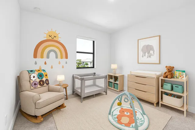 a bedroom with furniture and a window