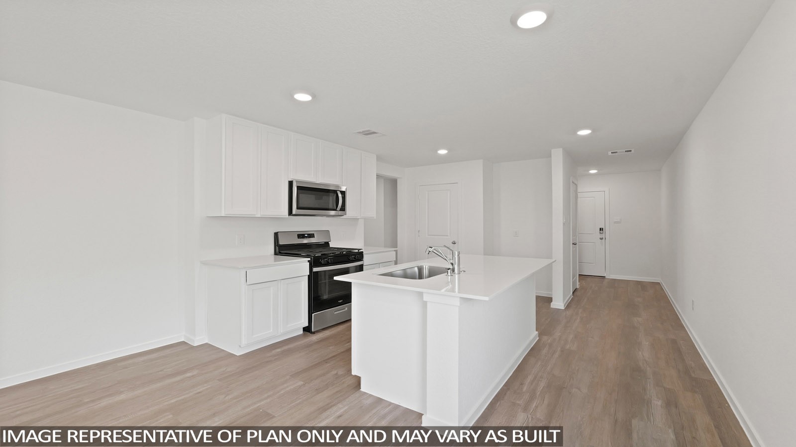 11707 Ruffian Drive Willis, TX 77318 - Photo 2 of 20 a kitchen with stainless steel appliances kitchen island sink stove and refrigerator