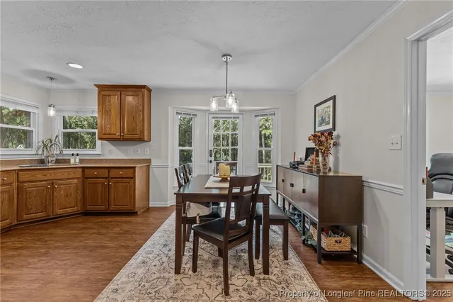 a view of a dining room with furniture and window