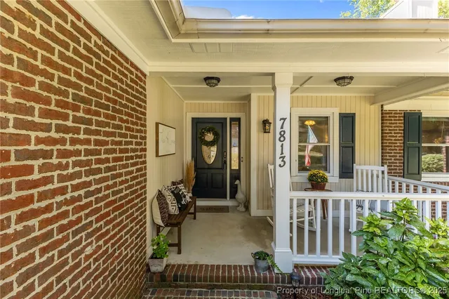 a view of porch with a bench