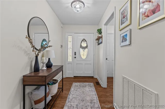 a view of entryway with wooden floor