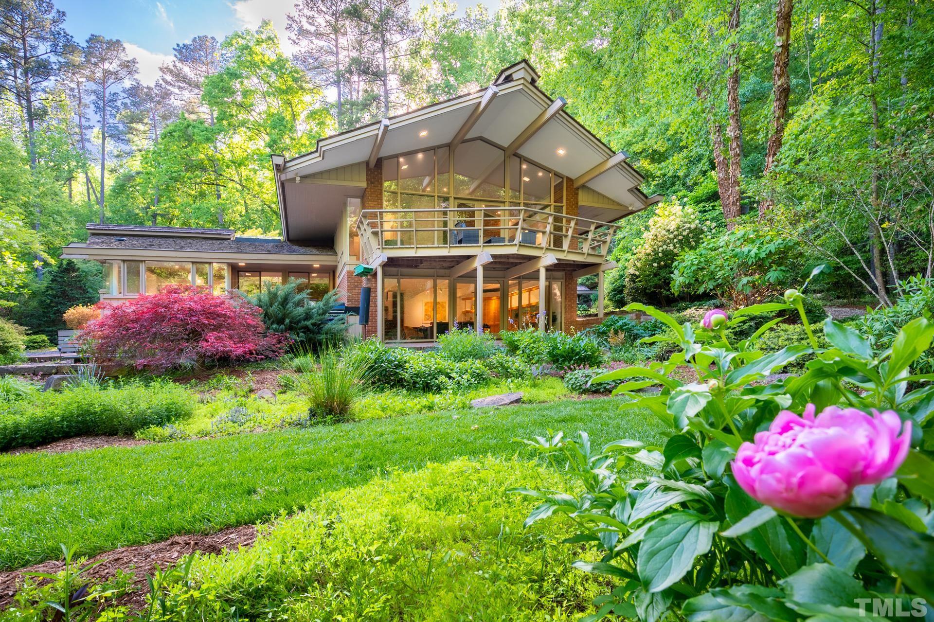 a front view of a house with yard