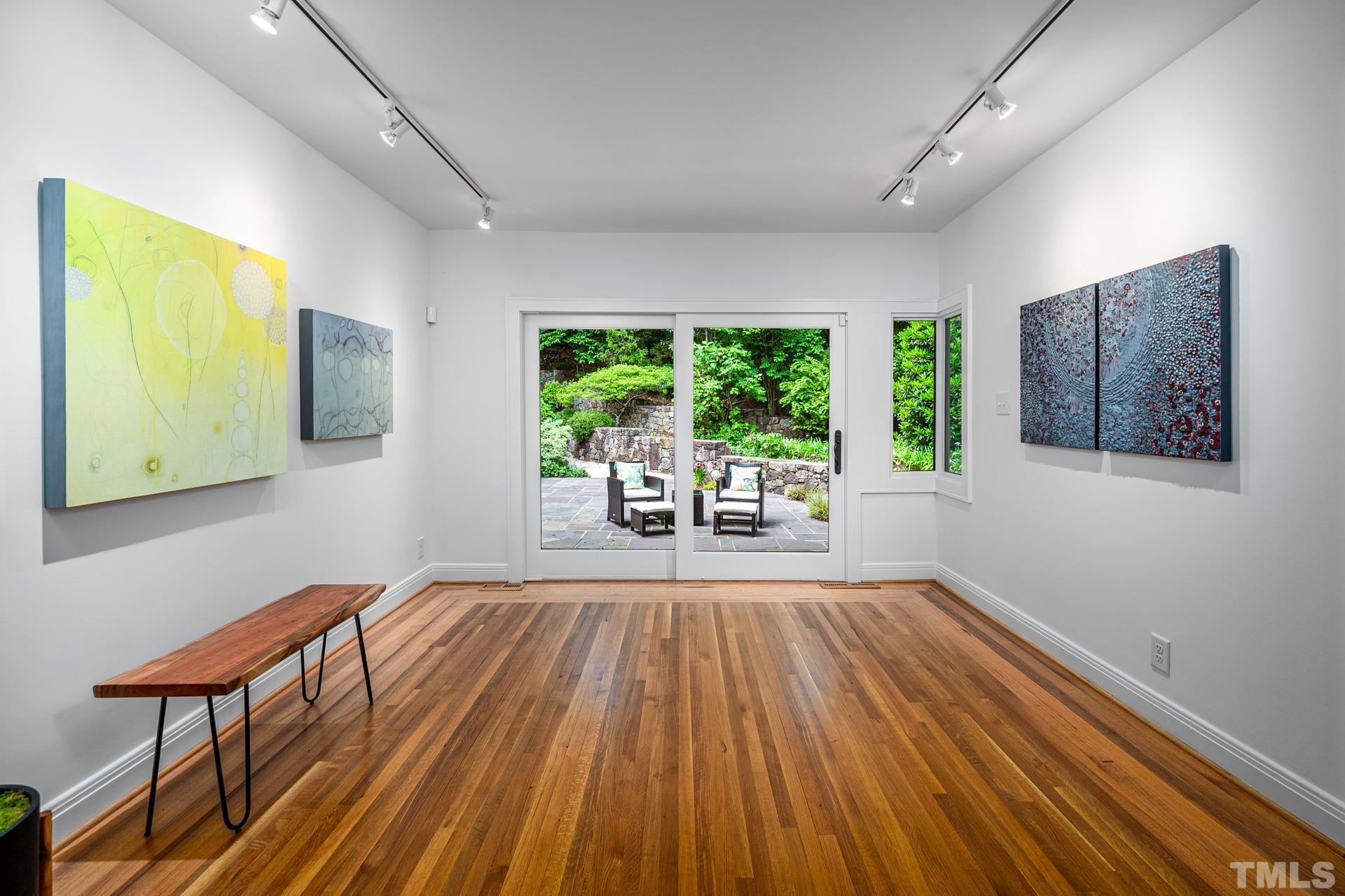 803 Cedar Falls Road Chapel Hill, NC 27514 - Photo 16 of 61 a view of a room with wooden floor and outdoor space
