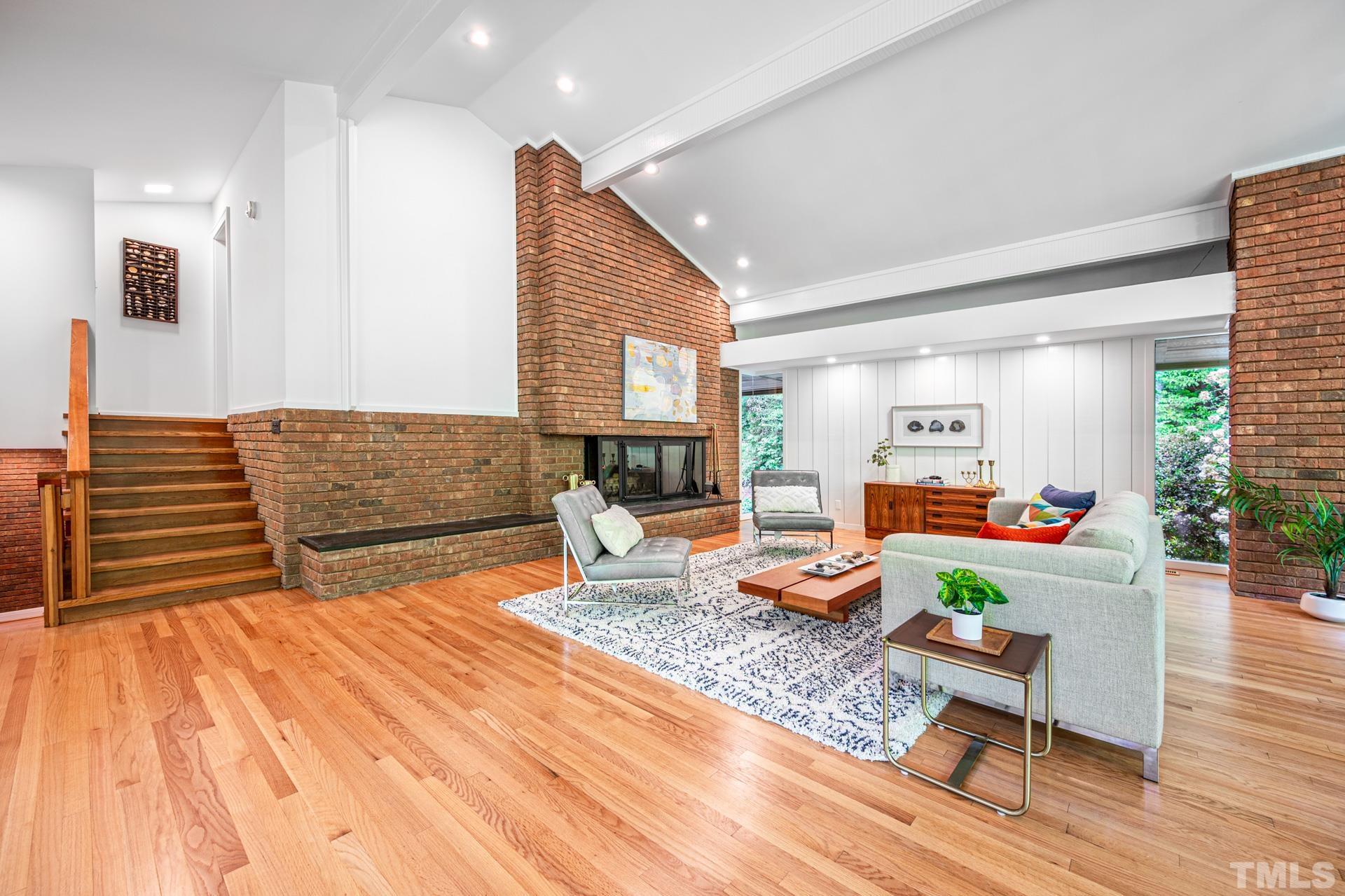 803 Cedar Falls Road Chapel Hill, NC 27514 - Photo 18 of 61 a living room with furniture and a wooden floor