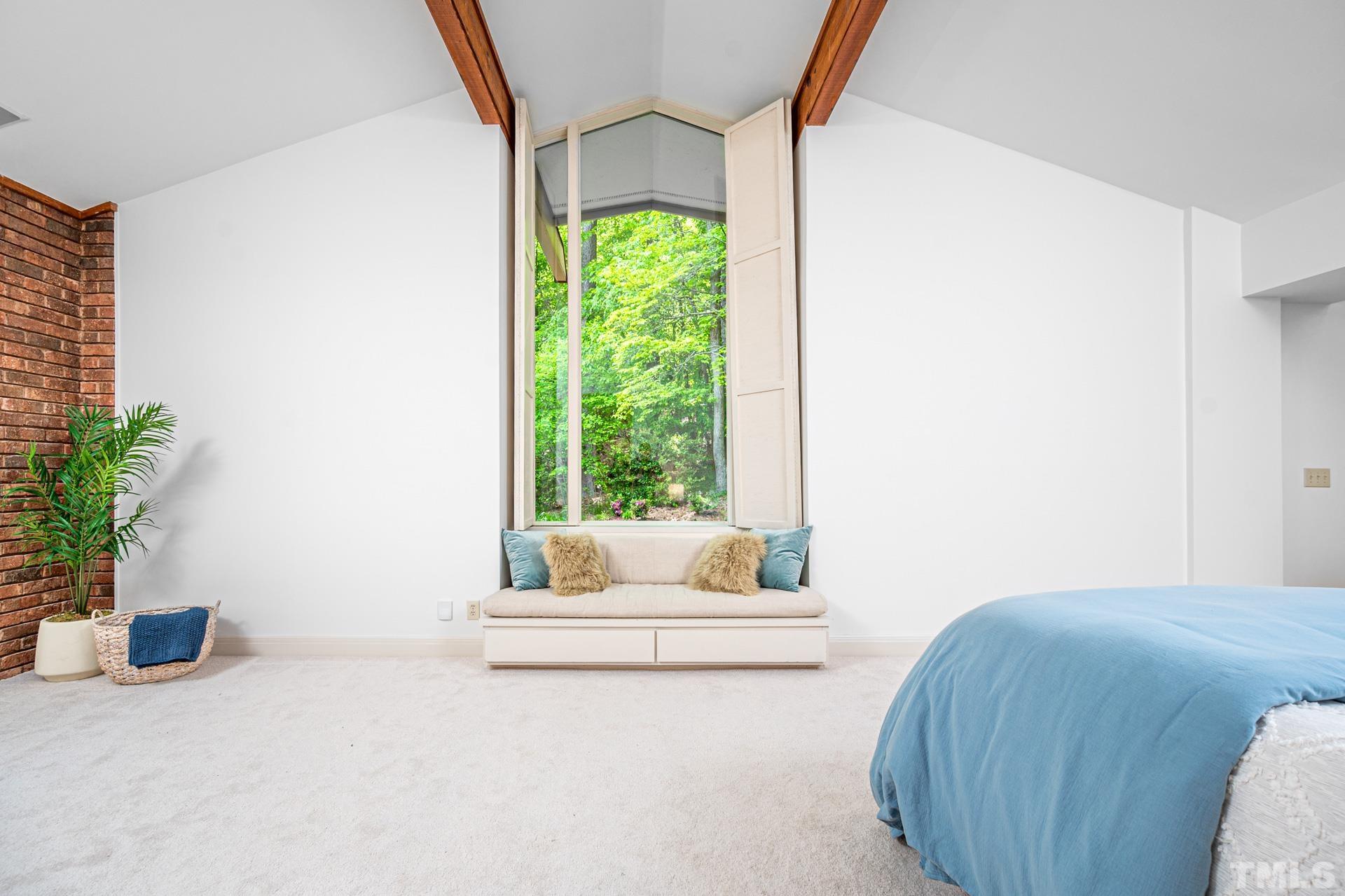 803 Cedar Falls Road Chapel Hill, NC 27514 - Photo 22 of 61 a bedroom with a bed and a window