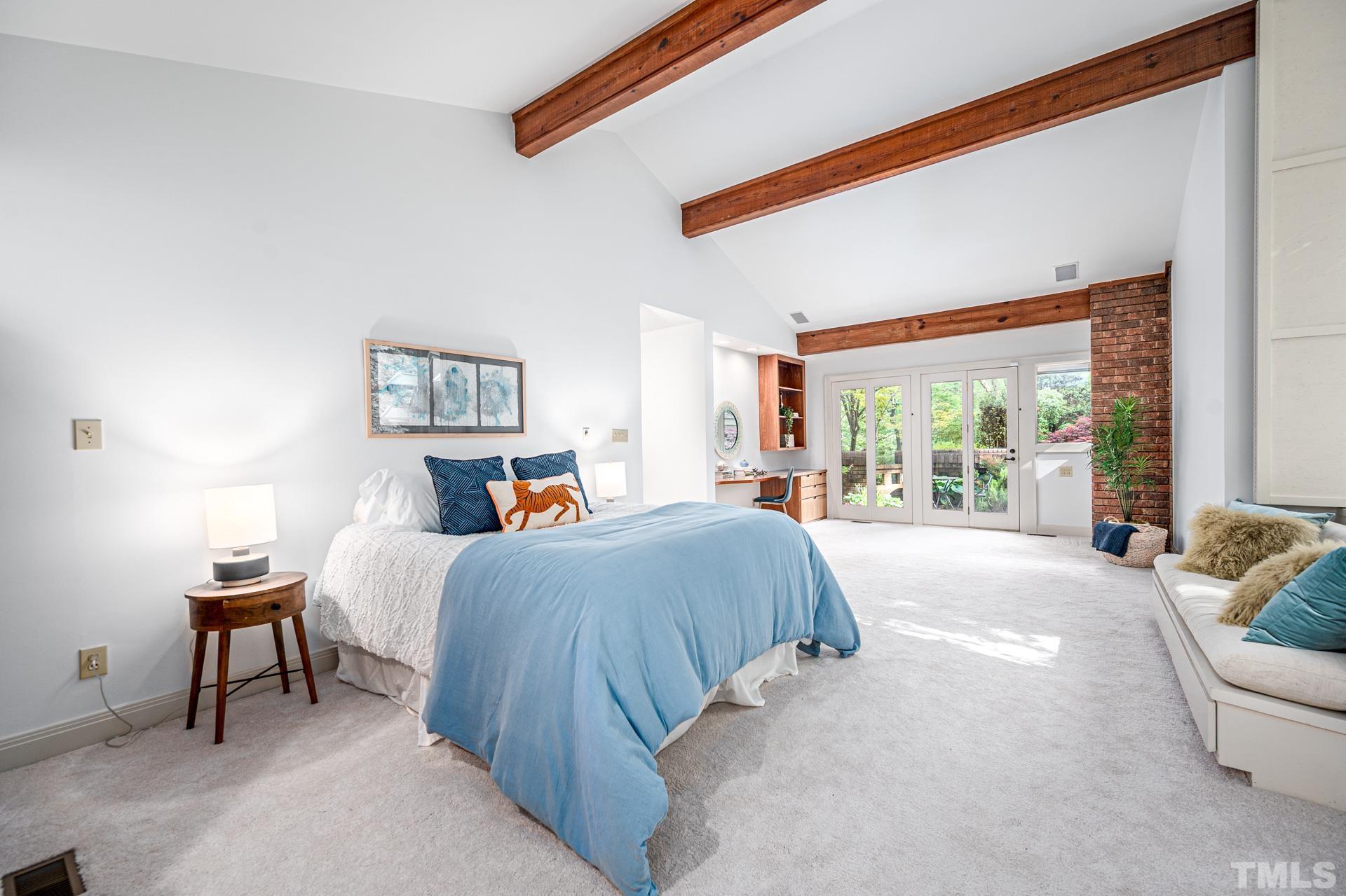 803 Cedar Falls Road Chapel Hill, NC 27514 - Photo 23 of 61 a bed room with a bed and a couch