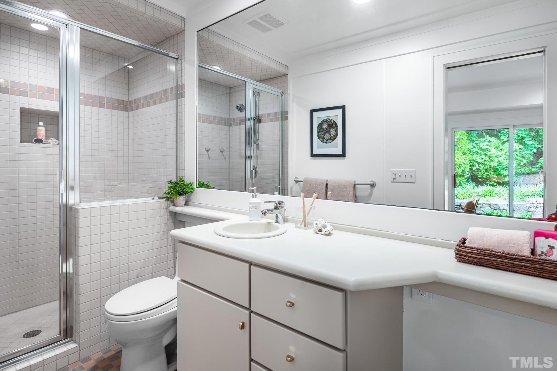803 Cedar Falls Road Chapel Hill, NC 27514 - Photo 39 of 61 a bathroom with a sink toilet and shower