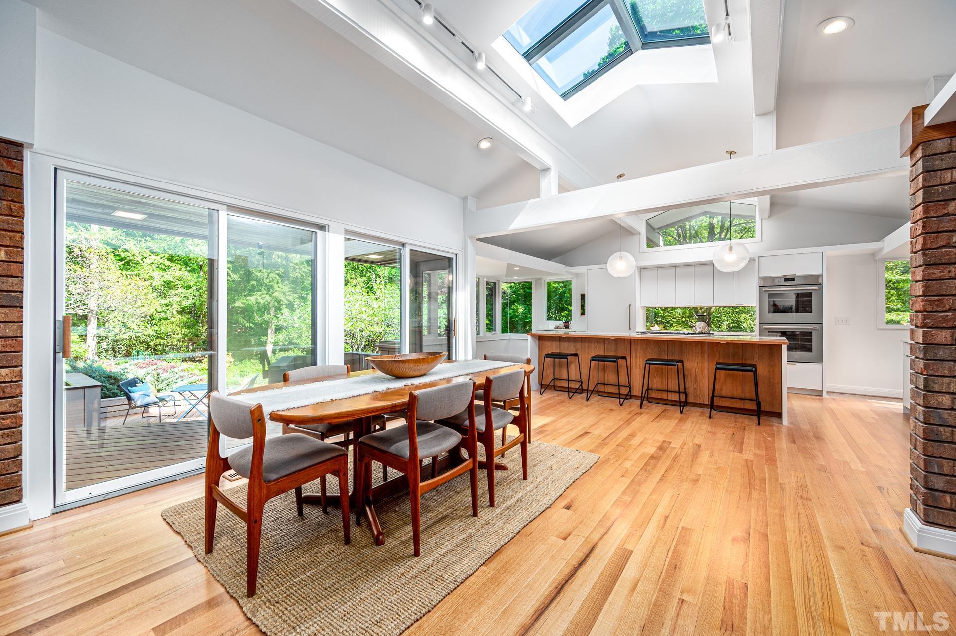 803 Cedar Falls Road Chapel Hill, NC 27514 - Photo 4 of 61 a view of a dining room with furniture and wooden floor