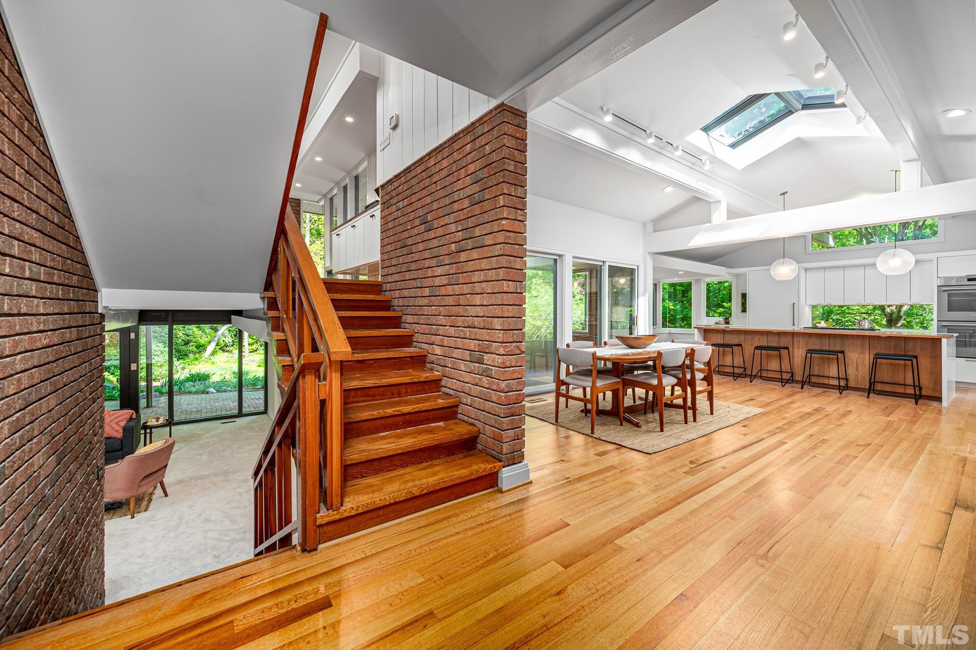 803 Cedar Falls Road Chapel Hill, NC 27514 - Photo 5 of 61 a view of a patio with table and chairs with wooden floor and fence