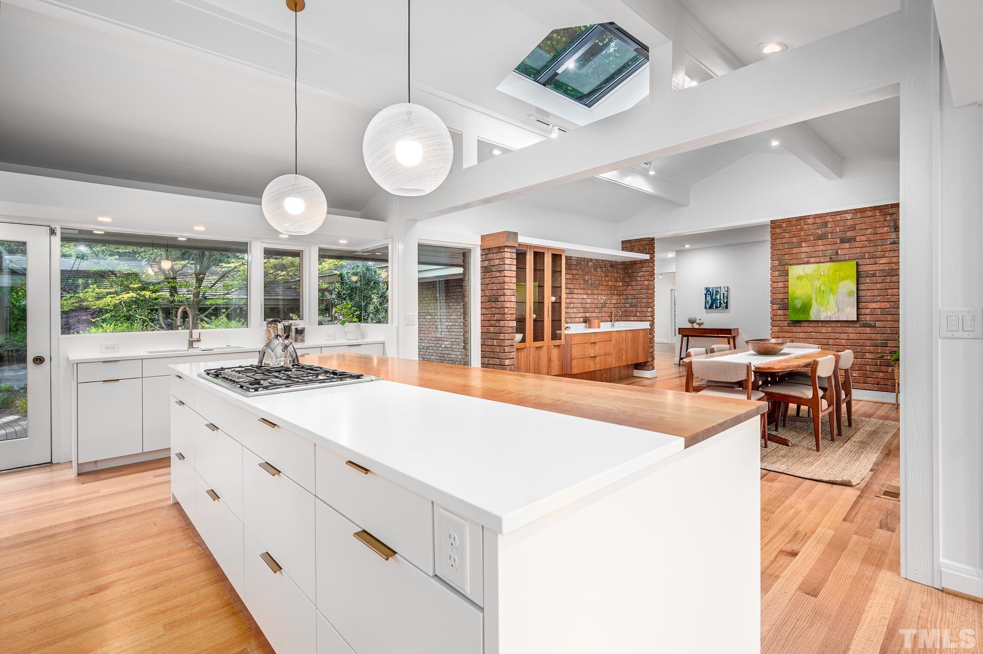 803 Cedar Falls Road Chapel Hill, NC 27514 - Photo 8 of 61 a large white kitchen with a large window