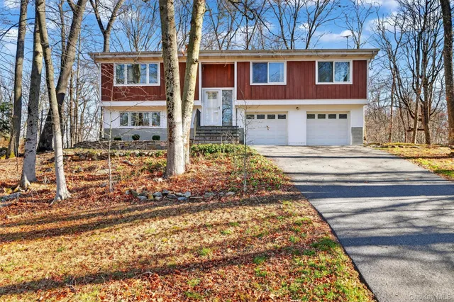 a view of a brick building next to a yard
