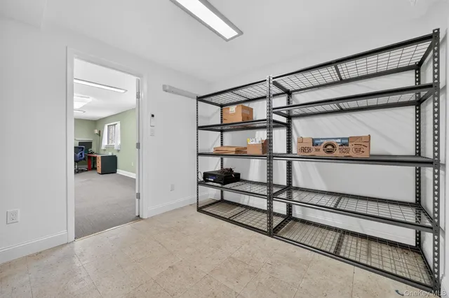 a view of a balcony with wooden floor and outdoor seating