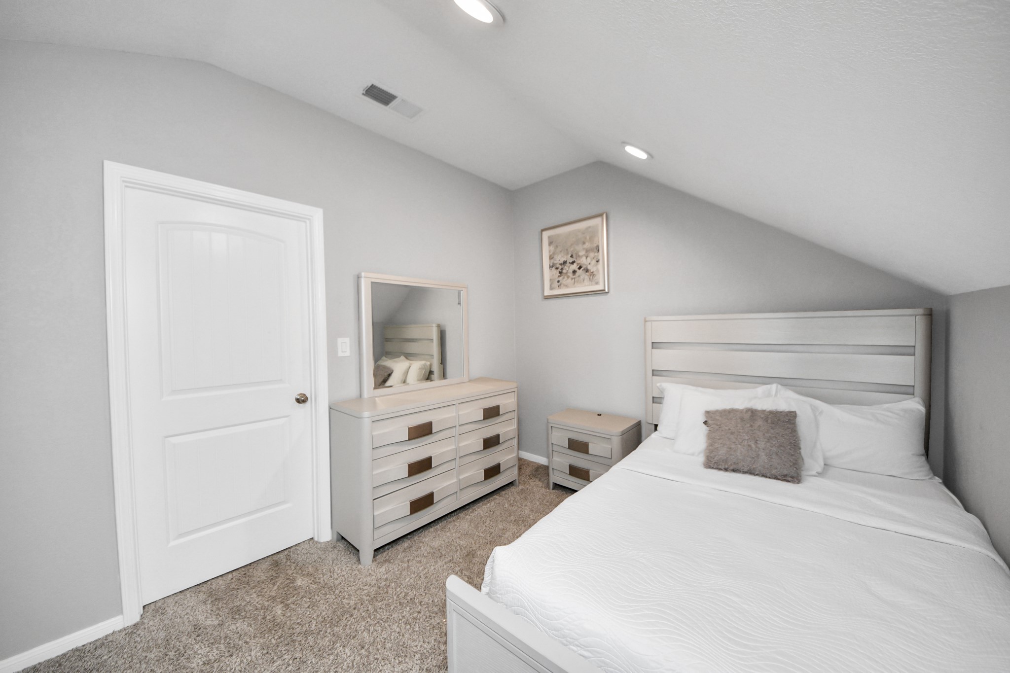 3514 Windham Way Katy, TX 77494 - Photo 18 of 42 a bedroom with a bed and dresser