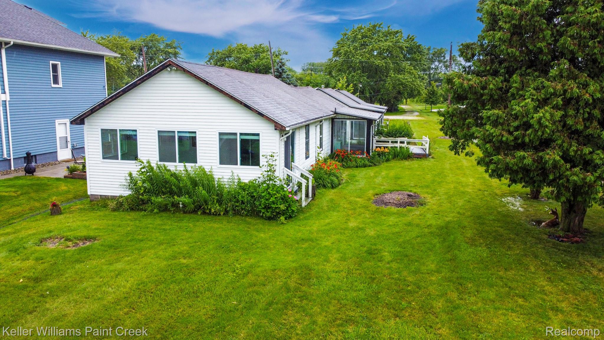 6533 River Road Marine City, MI 48039 - Photo 4 of 17 Back of property featuring a lawn