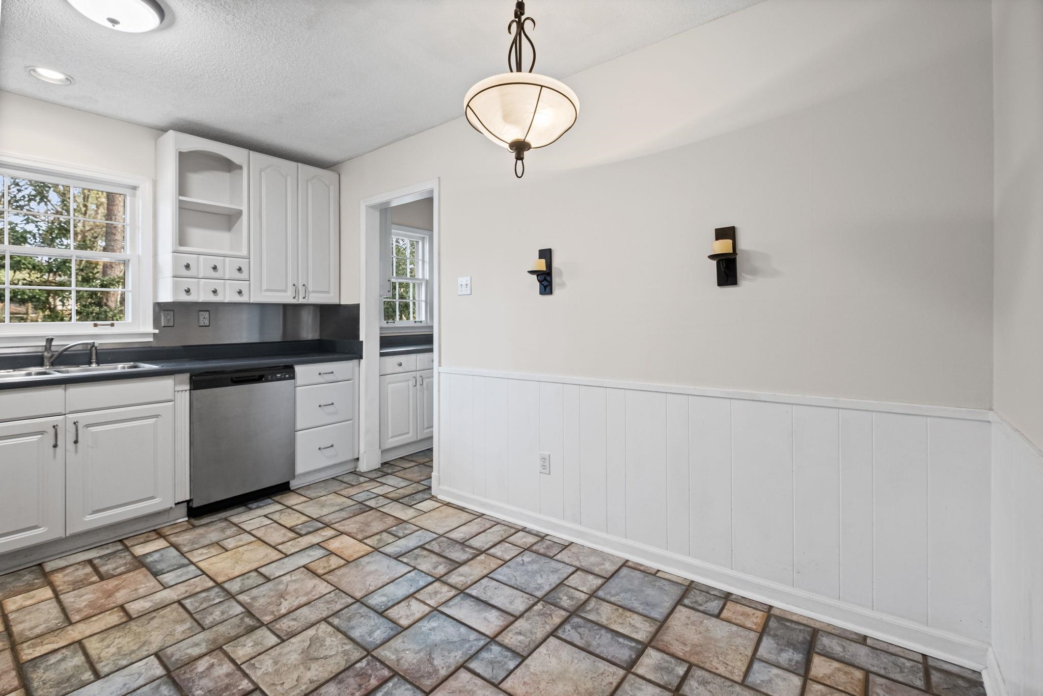 2432 Hawkhurst Street Memphis, TN 38119 - Photo 12 of 31 a kitchen with a sink cabinets and window