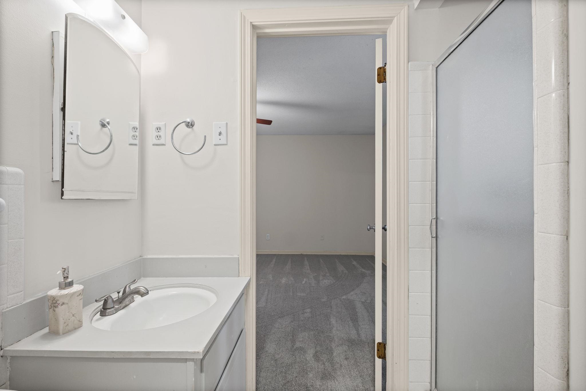 2432 Hawkhurst Street Memphis, TN 38119 - Photo 19 of 31 a bathroom with a sink and a mirror