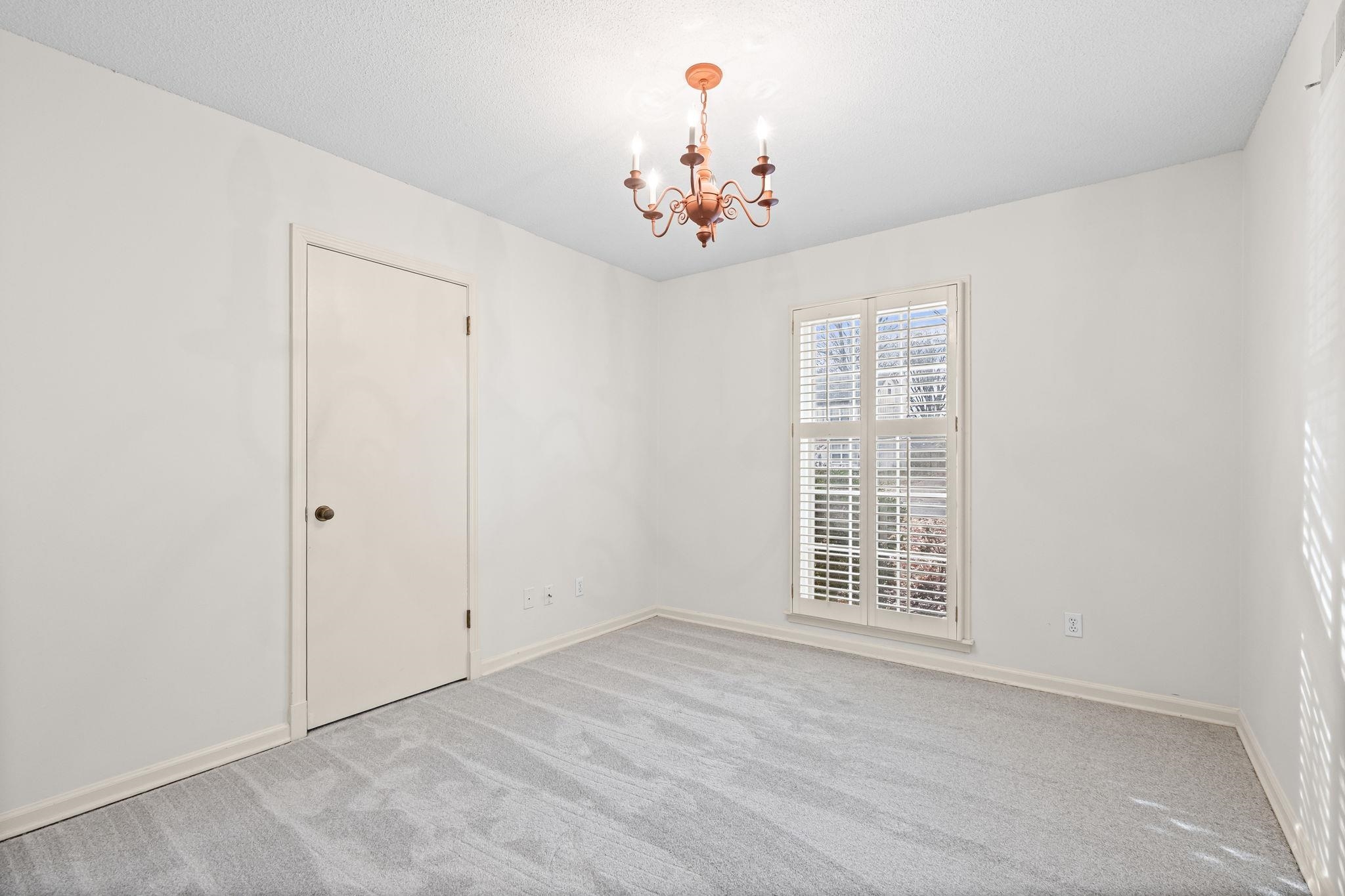 2432 Hawkhurst Street Memphis, TN 38119 - Photo 24 of 31 a view of an empty room with a window