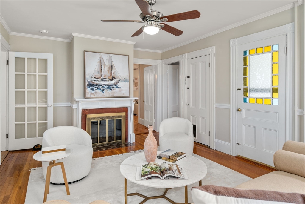 110 Mt Vernon Street Dedham, MA 02026 - Photo 12 of 35 a living room with furniture and a fireplace