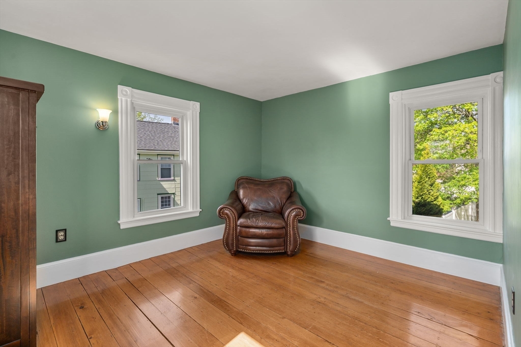 110 Mt Vernon Street Dedham, MA 02026 - Photo 19 of 35 a living room with a couch and a window