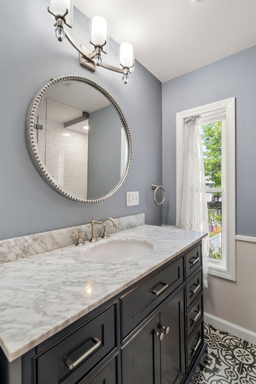 110 Mt Vernon Street Dedham, MA 02026 - Photo 20 of 35 a bathroom with a granite countertop sink and a mirror