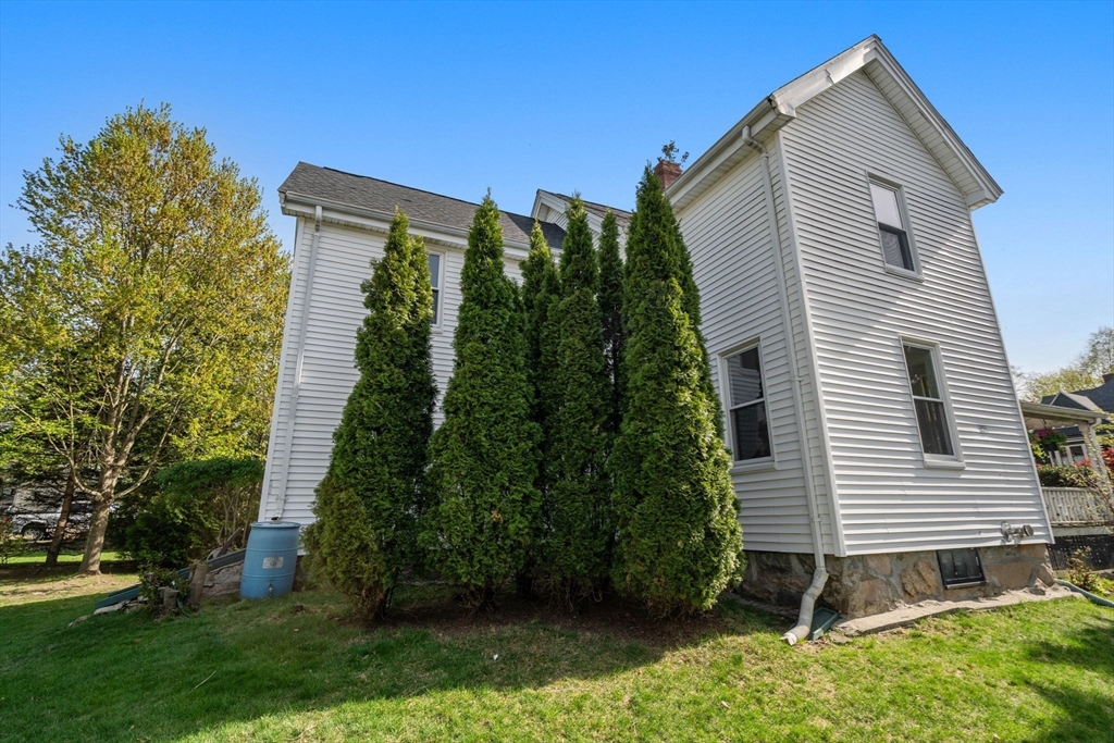 110 Mt Vernon Street Dedham, MA 02026 - Photo 30 of 35 a backyard of a house with lots of green space