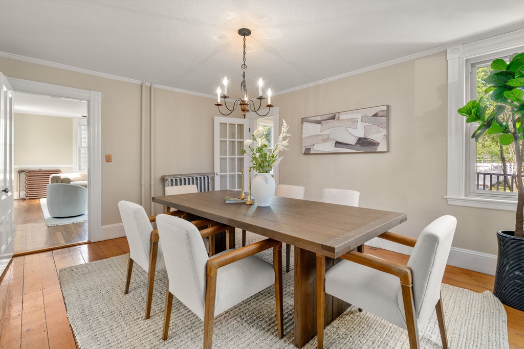 110 Mt Vernon Street Dedham, MA 02026 - Photo 10 of 35 a view of a dining room with furniture a chandelier and wooden floor