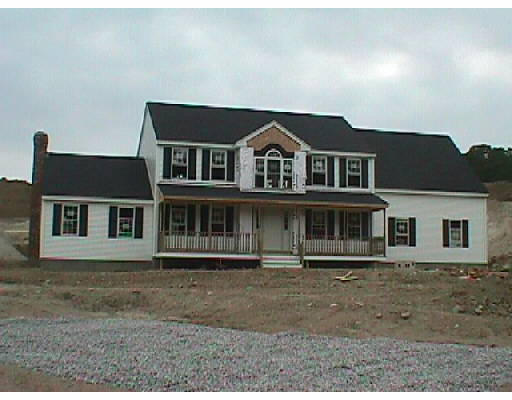 Lot 8 Mendon Road Sutton, MA 01590 - Photo 1 of 1 a front view of a house with a yard
