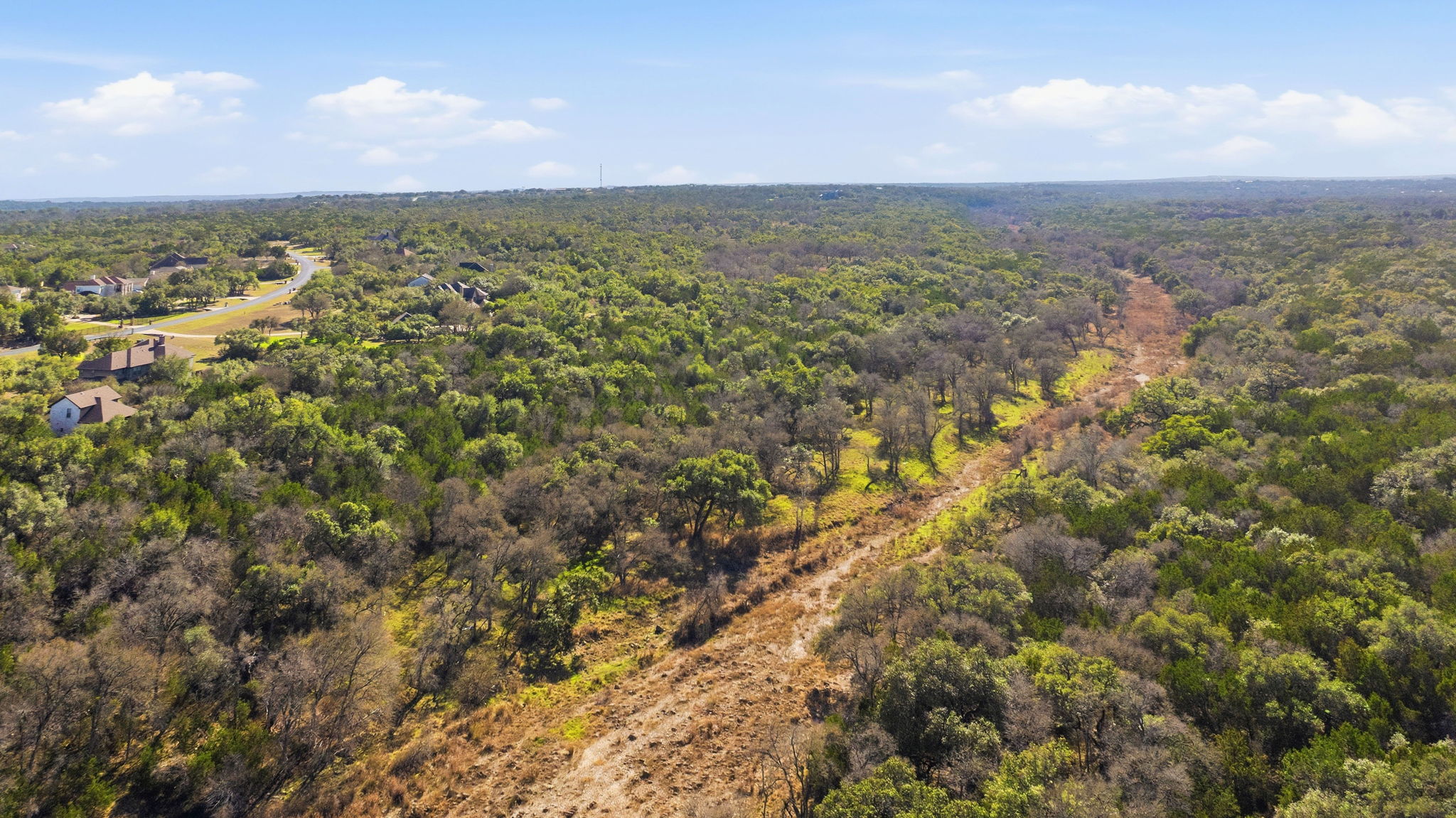 1081 Clark Cove Road Buda, TX 78610 - Photo 10 of 29 Drone / aerial view of the lot and the creek bed