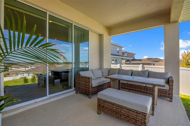 a outdoor living space with furniture and a potted plant