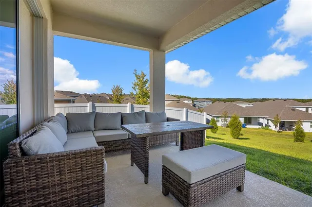 a balcony with furniture and city view