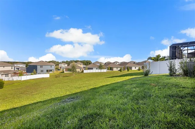 a view of a house with a big yard