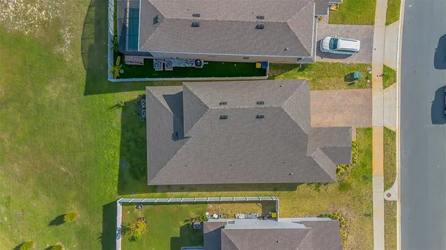 an aerial view of a house with a swimming pool