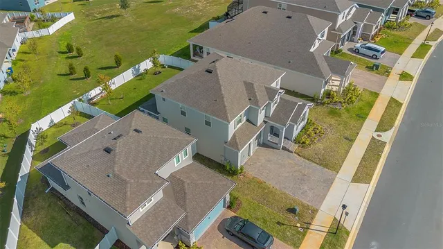 an aerial view of a house with a swimming pool