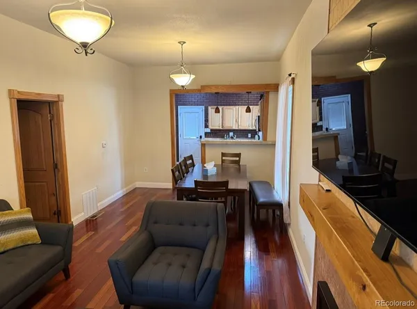 a bedroom with a bed and a cabinet