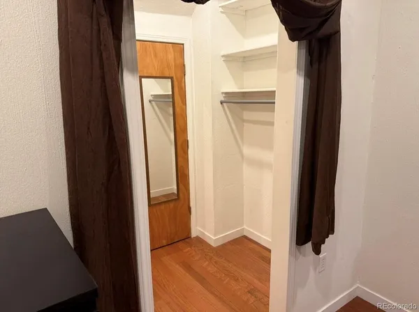 a bathroom with a sink vanity mirror and toilet
