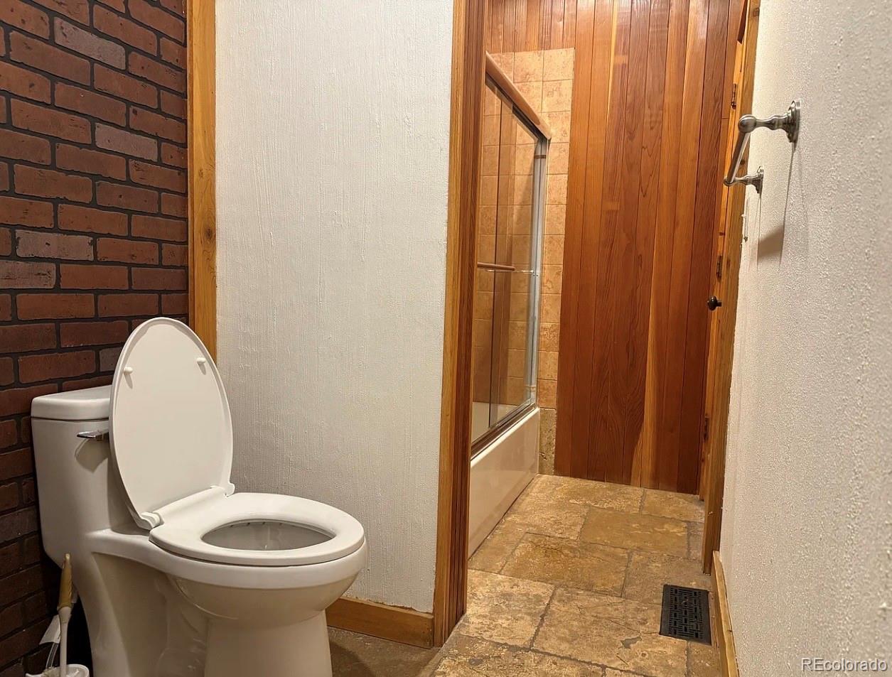 4353 Kalamath Street Denver, CO 80211 - Photo 18 of 28 a bathroom with a toilet and a shower