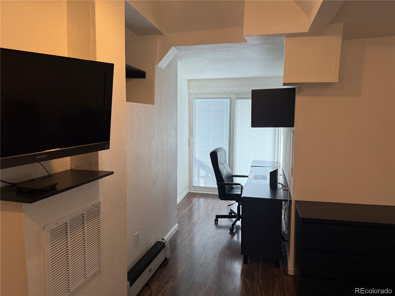 4353 Kalamath Street Denver, CO 80211 - Photo 21 of 28 a view of workspace with wooden floor windows