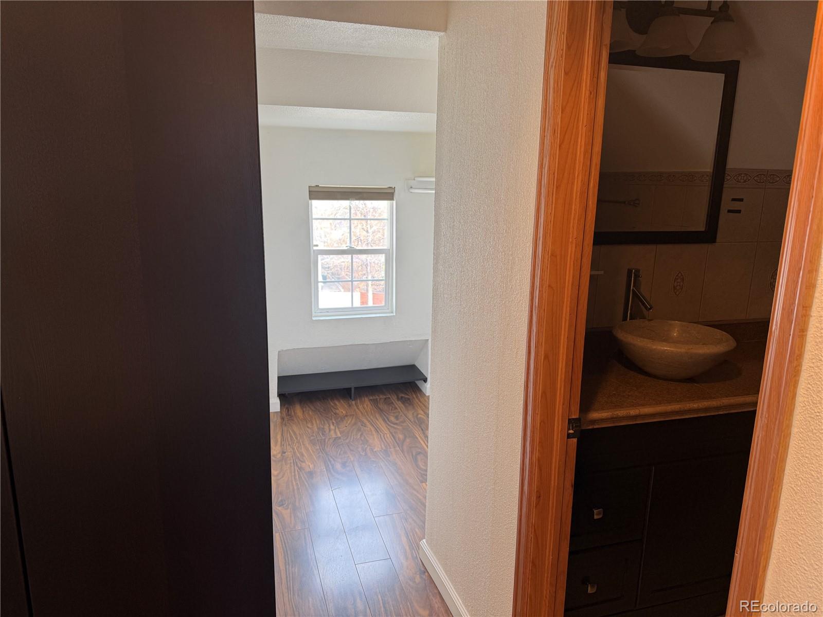 4353 Kalamath Street Denver, CO 80211 - Photo 24 of 28 a view of an entryway with wooden floor