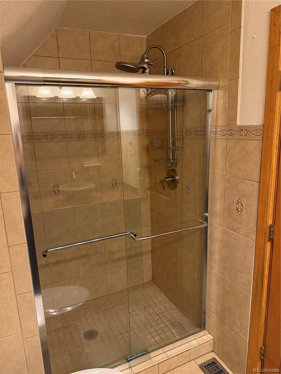 4353 Kalamath Street Denver, CO 80211 - Photo 25 of 28 a bathroom with a shower