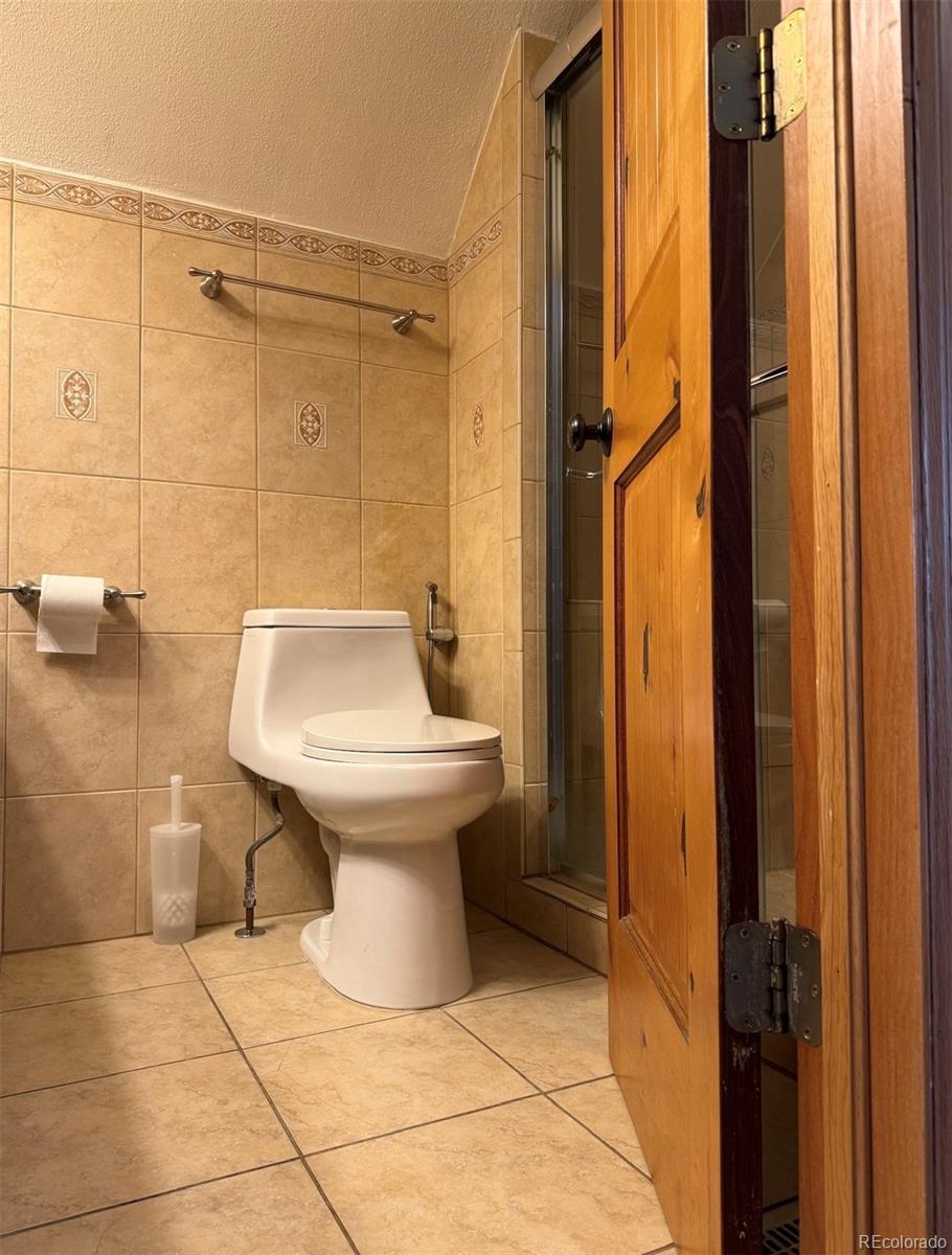 4353 Kalamath Street Denver, CO 80211 - Photo 26 of 28 a bathroom with a sink toilet and shower
