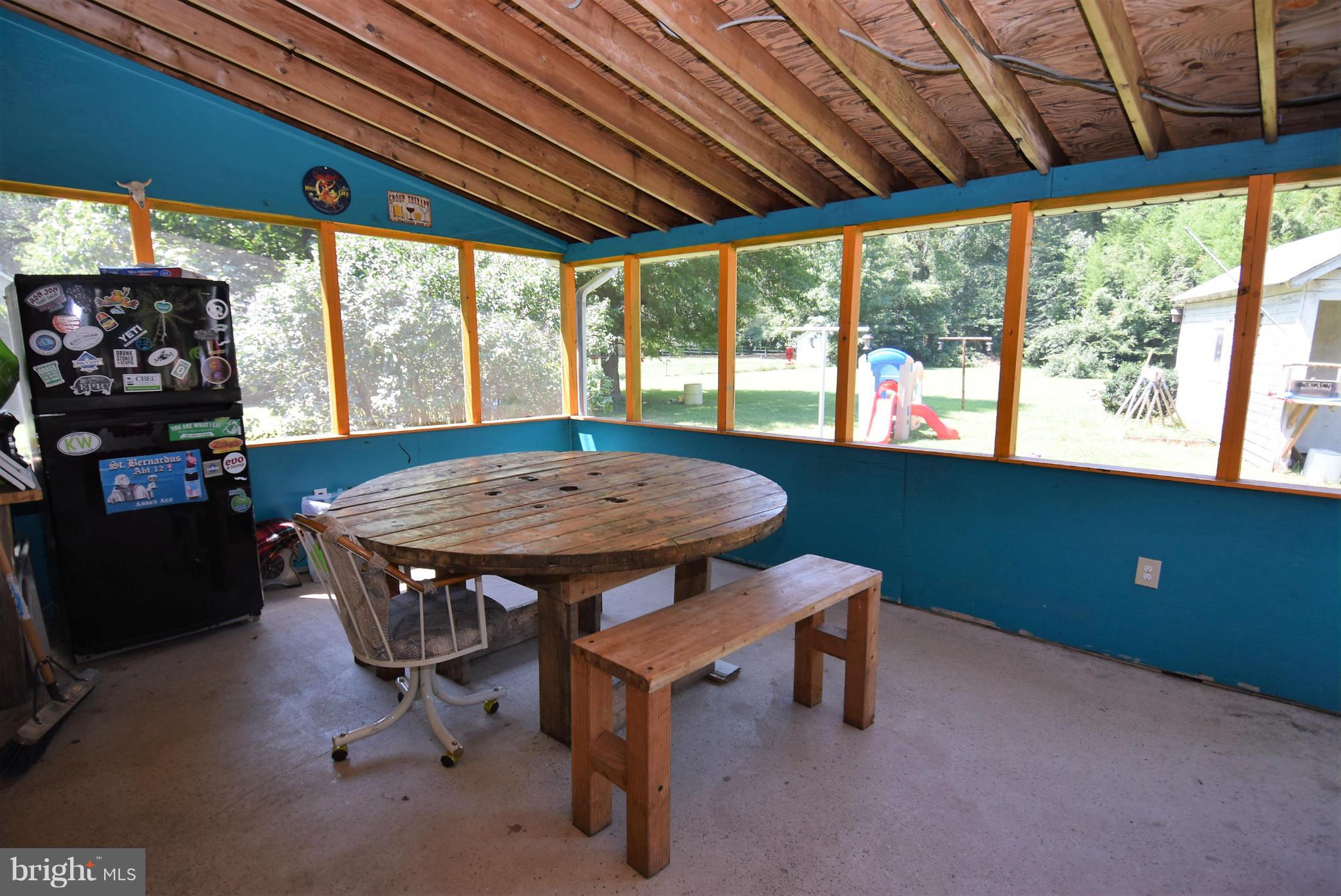 7110 Highbridge Road Bowie, MD 20720 - Photo 17 of 29 Screened in back porch