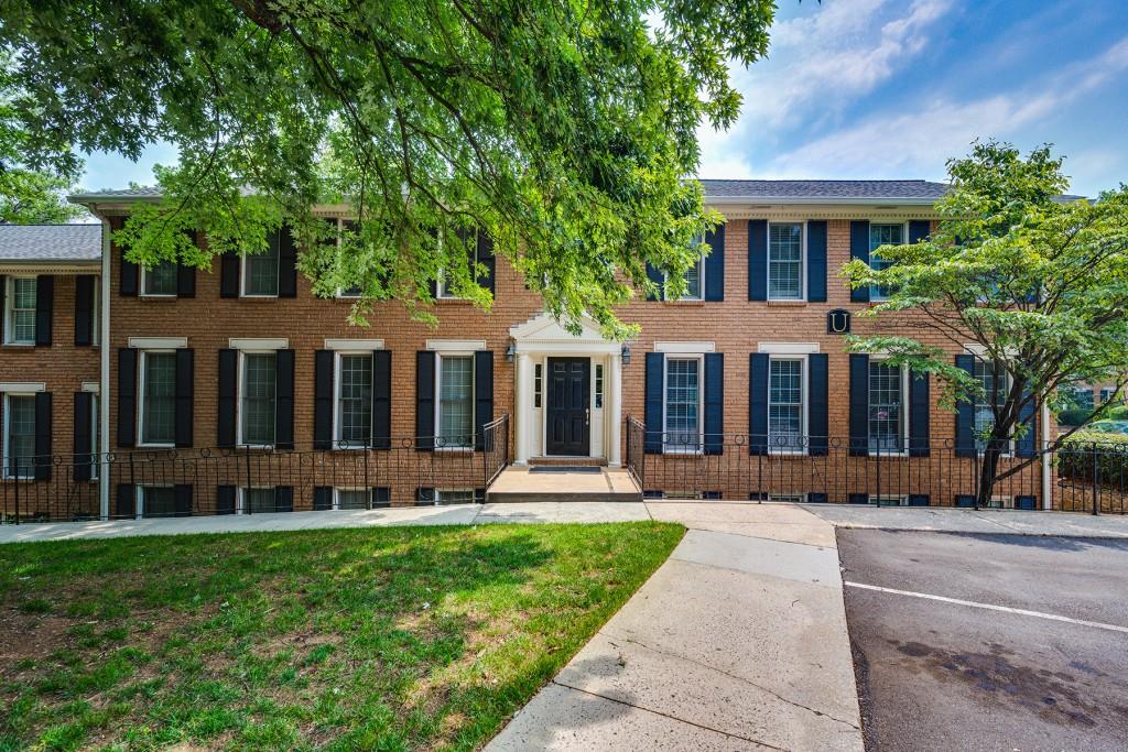 1101 Collier Road Northwest, Unit U4 Atlanta, GA 30318 - Photo 1 of 1 a front view of a house with a yard garden