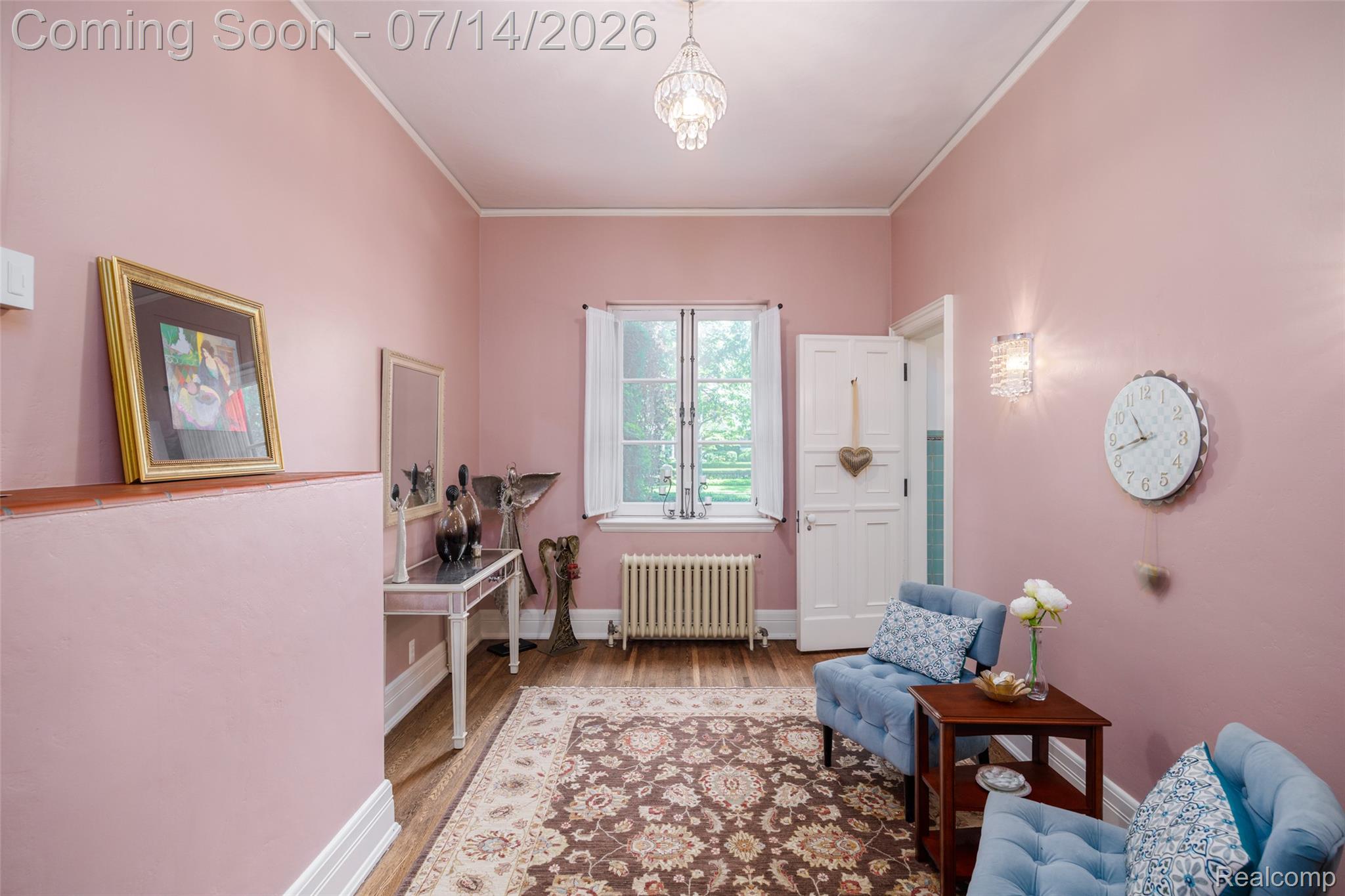 189 Cloverly Road Grosse Pointe, MI 48236 - Photo 29 of 96 Spacious room featuring wood-finish flooring, a decorative area rug, and a window with white shutters