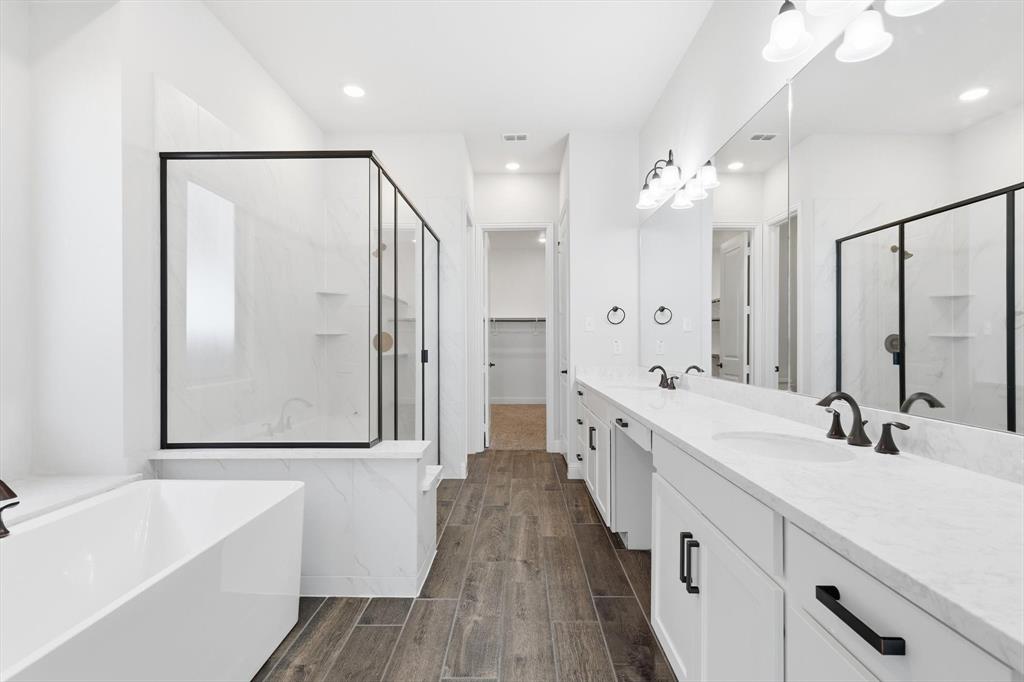 18140 Lakefront Court Forney, TX 75126 - Photo 19 of 37 Full bathroom featuring a freestanding tub, a marble finish shower, a spacious closet, double vanity, and recessed lighting