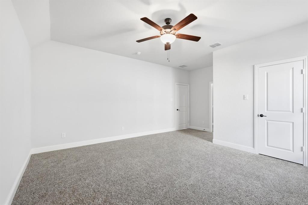 18140 Lakefront Court Forney, TX 75126 - Photo 26 of 37 Unfurnished bedroom with carpet floors and ceiling fan