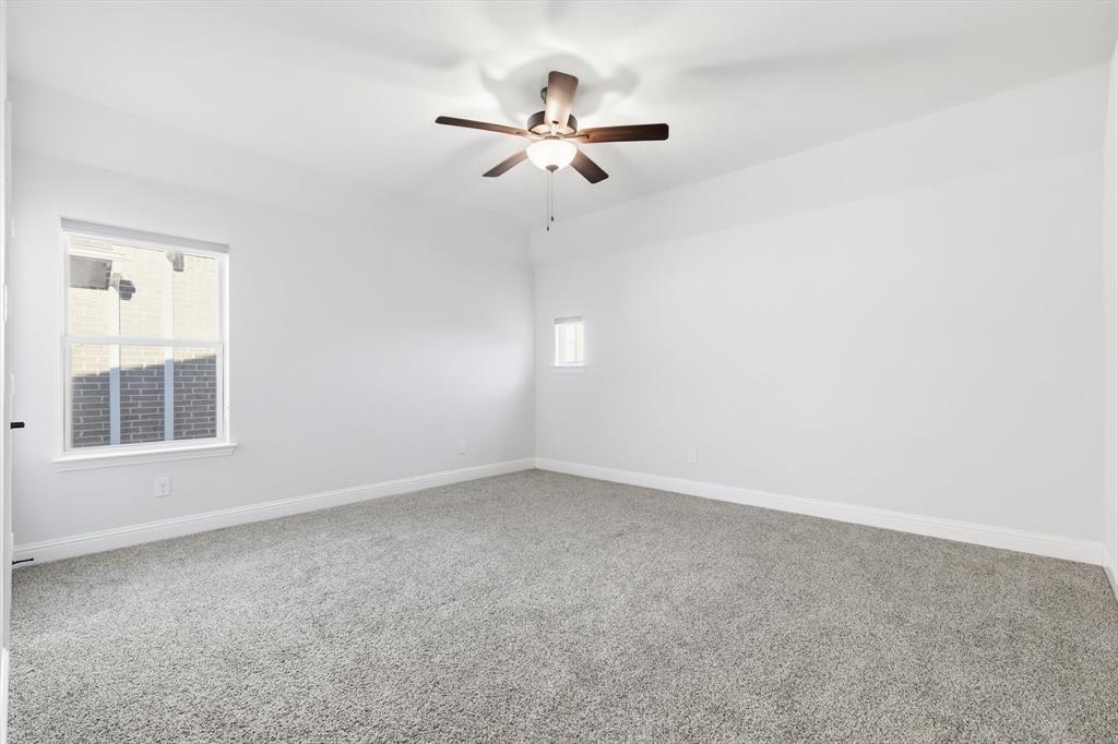 18140 Lakefront Court Forney, TX 75126 - Photo 32 of 37 Empty room featuring carpet floors and ceiling fan