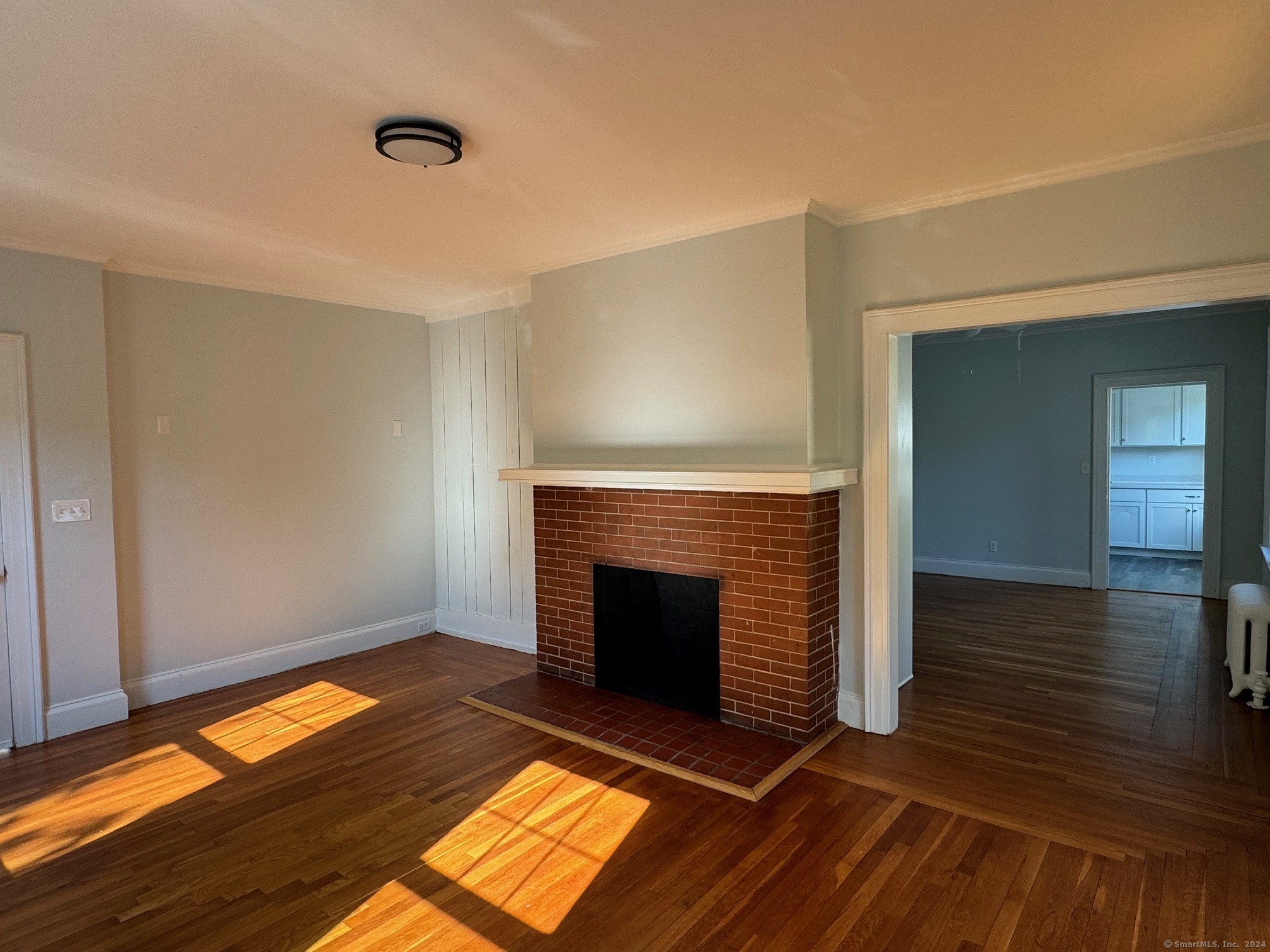 1253 Forest Road, Unit 2 New Haven, CT 06515 - Photo 8 of 30 a living room with a fireplace