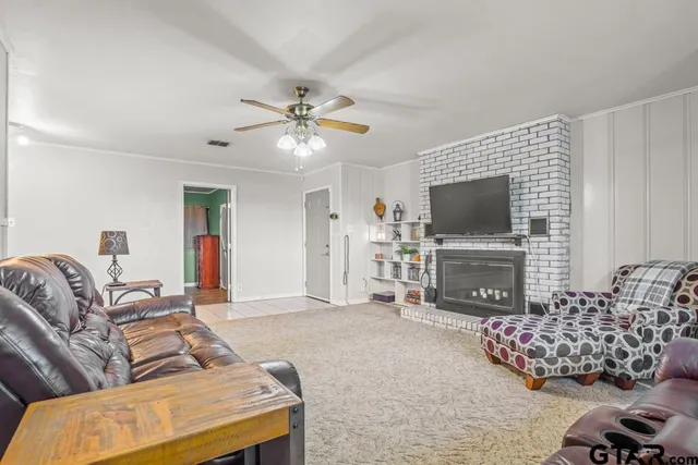 a living room with furniture and a flat screen tv